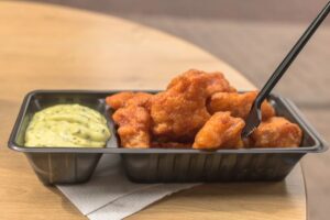Picture of a nice portion of kibbeling with sauce